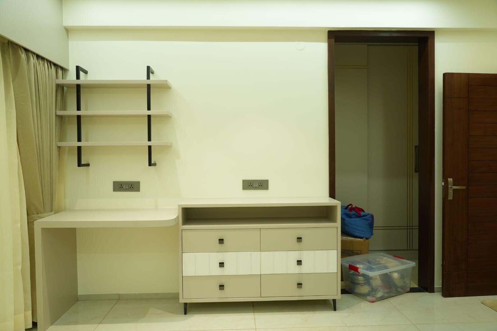 Modern bedroom with integrated desk and custom storage solutions