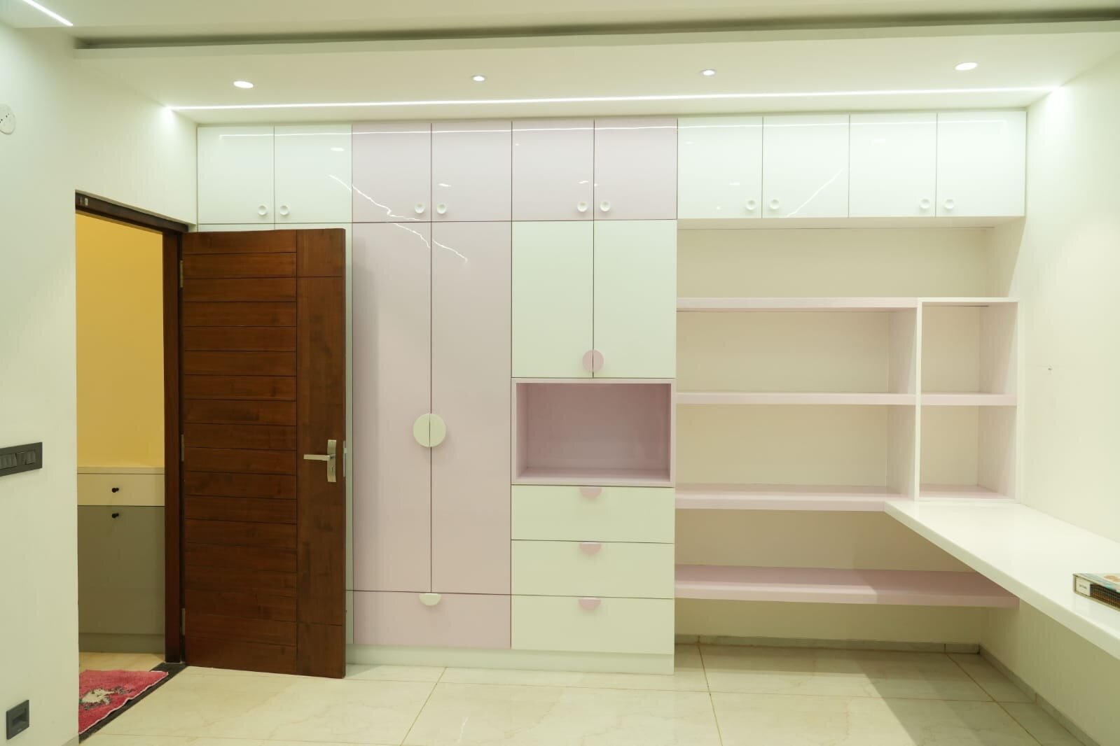 Modern hallway entrance with marble flooring and contemporary lighting