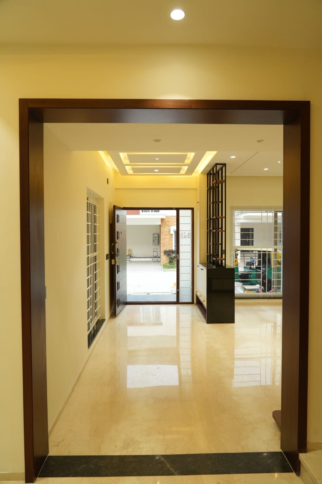 Luxury entertainment wall with marble panels and modern console