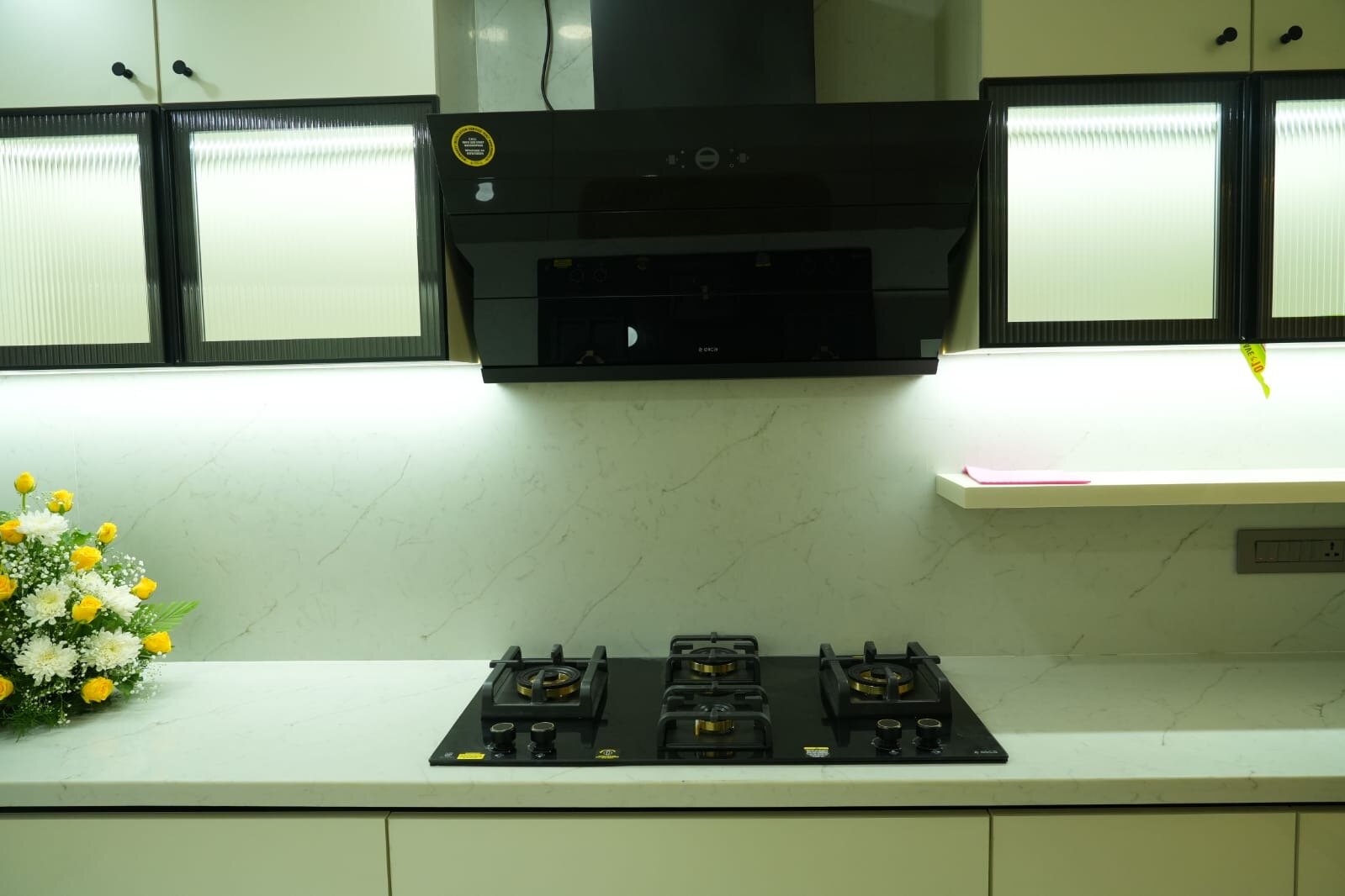 Modern bedroom with pastel cabinetry and integrated lighting solutions