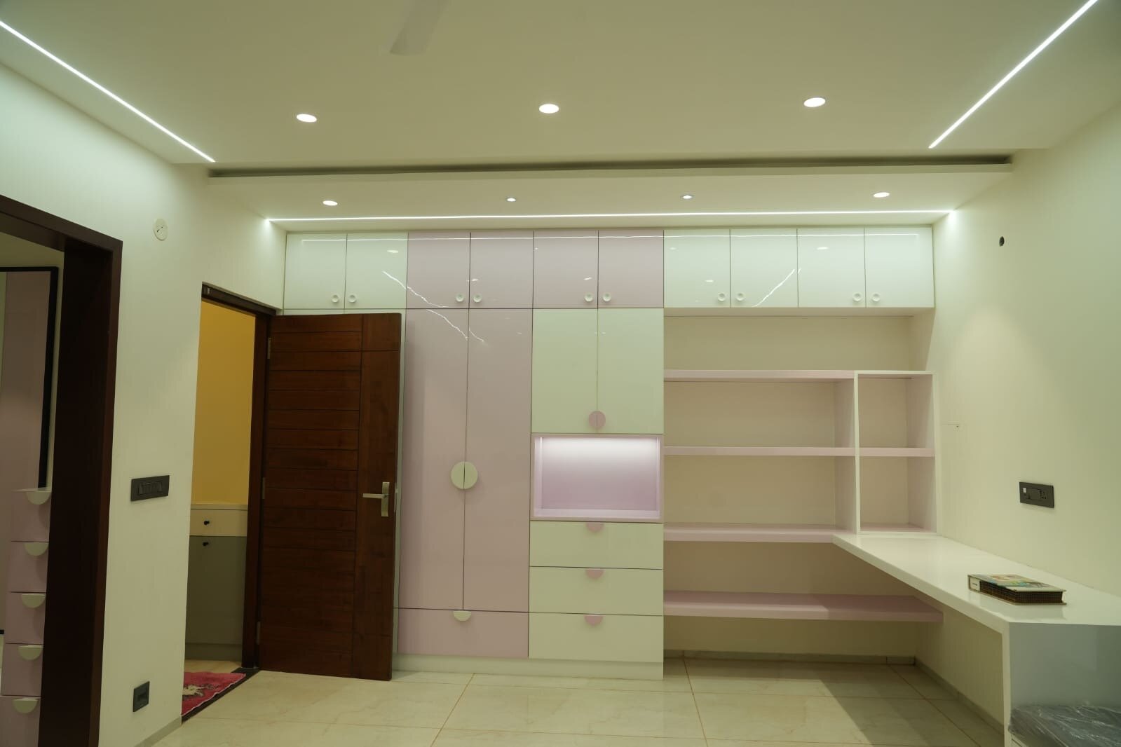 Luxury bedroom with upholstered headboard and marble feature wall